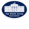 The image shows the official logo of the White House, featuring a white illustration of the White House building on a dark blue oval background with the words The White House Washington below.